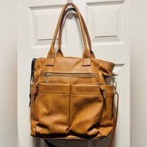 Brown patent leather diaper bag with multiple pockets and key holders
